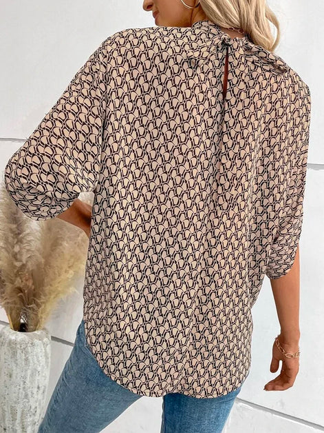 Rivella Bluse mit Retro Muster und kurzen Ärmeln in figurbetonter Passform