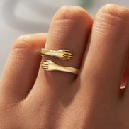 Handoria Damenring mit verschlungenem Handdesign und offener Form