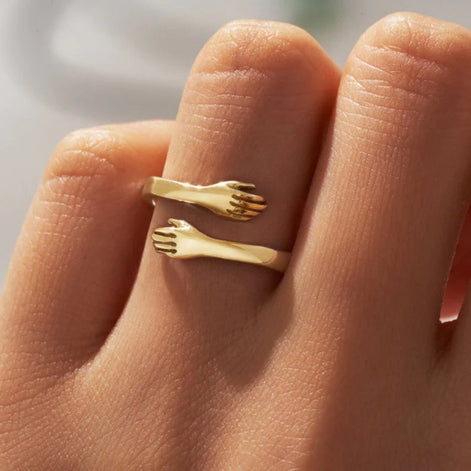Handoria Damenring mit verschlungenem Handdesign und offener Form