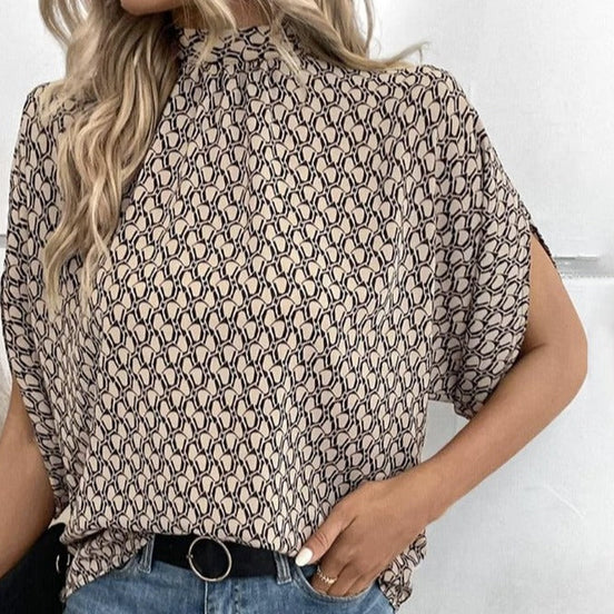 Rivella Bluse mit Retro Muster und kurzen Ärmeln in figurbetonter Passform