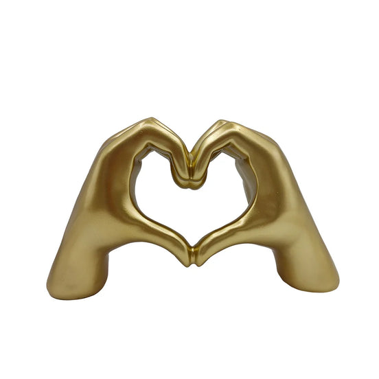 Herzförmige Handskulptur aus Kunstharz