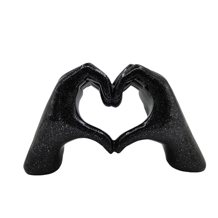 Herzförmige Handskulptur aus Kunstharz