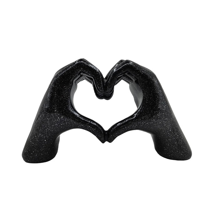 Herzförmige Handskulptur aus Kunstharz