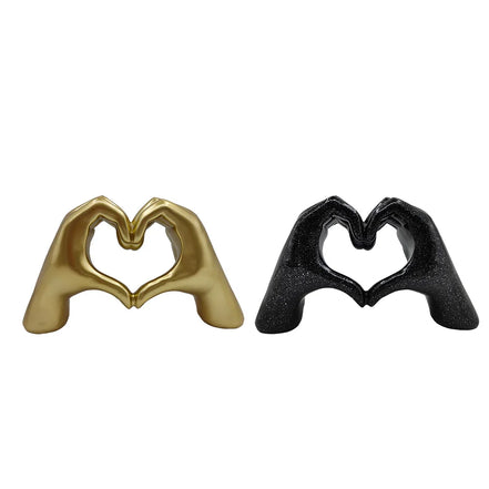 Herzförmige Handskulptur aus Kunstharz