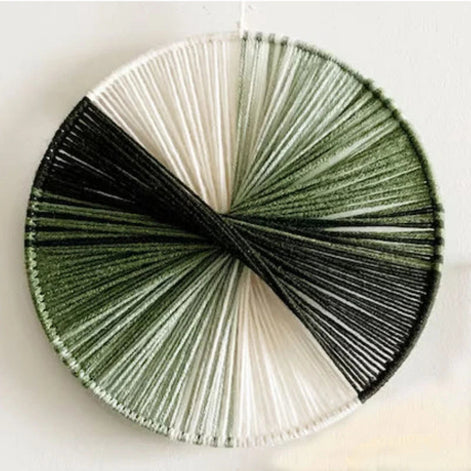 Wandkunst aus Baumwollfäden mit kreisförmigem Design
