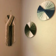 Wandkunst aus Baumwollfäden mit kreisförmigem Design